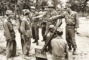 NICOLAS TIKHOMIROV (1927-2016) A group of 9 photographs documenting political instability and civil war in Cold War-era Laos.